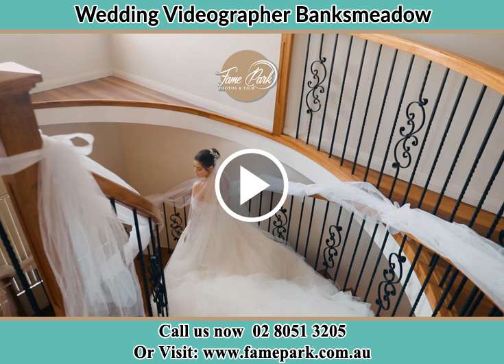 Bride walking down the staircase Banksmeadow NSW 2019