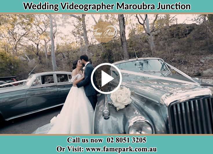 Bride and Groom kissed beside the bridal car Maroubra Junction NSW 2035