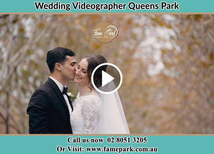 The Groom kissing the cheeks of his Bride Queens Park NSW 2022