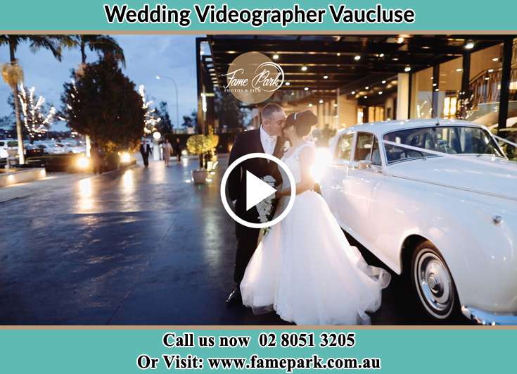 The newly weds kissing beside their bridal car Vaucluse NSW 2030