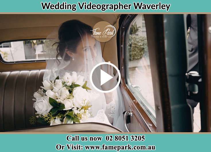 The bride holding the flower bouquet inside the wedding car Waverley NSW 2024